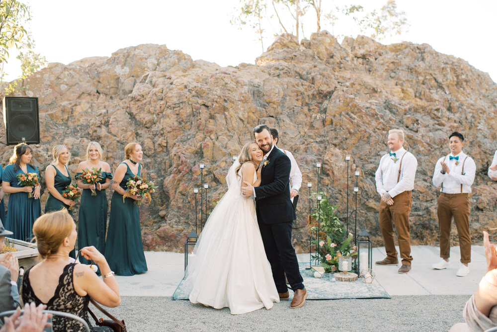 Outdoor wedding ceremony by the rocks